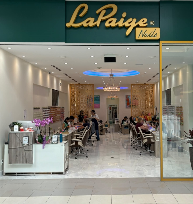 Front entrance and interior view of La Paige Nails Champlain salon
