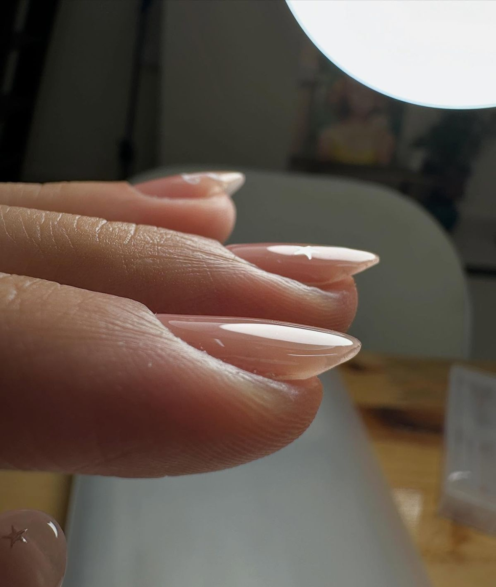 Side profile view of almond shaped gel overlay showing balanced apex curve