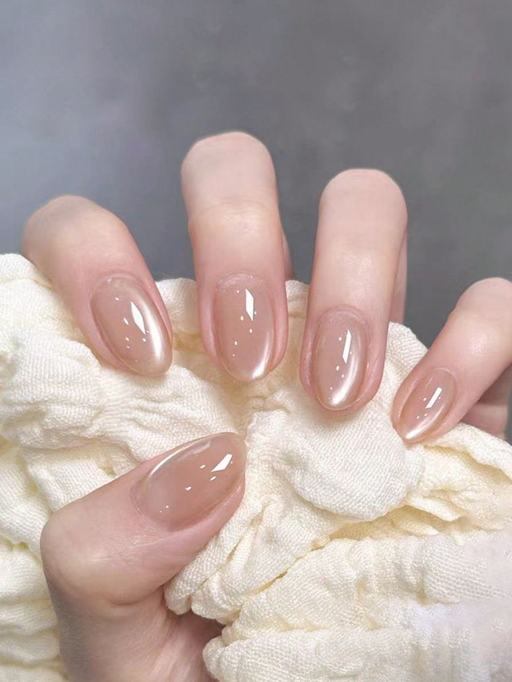 Short oval glazed donut nails with glossy nude chrome finish